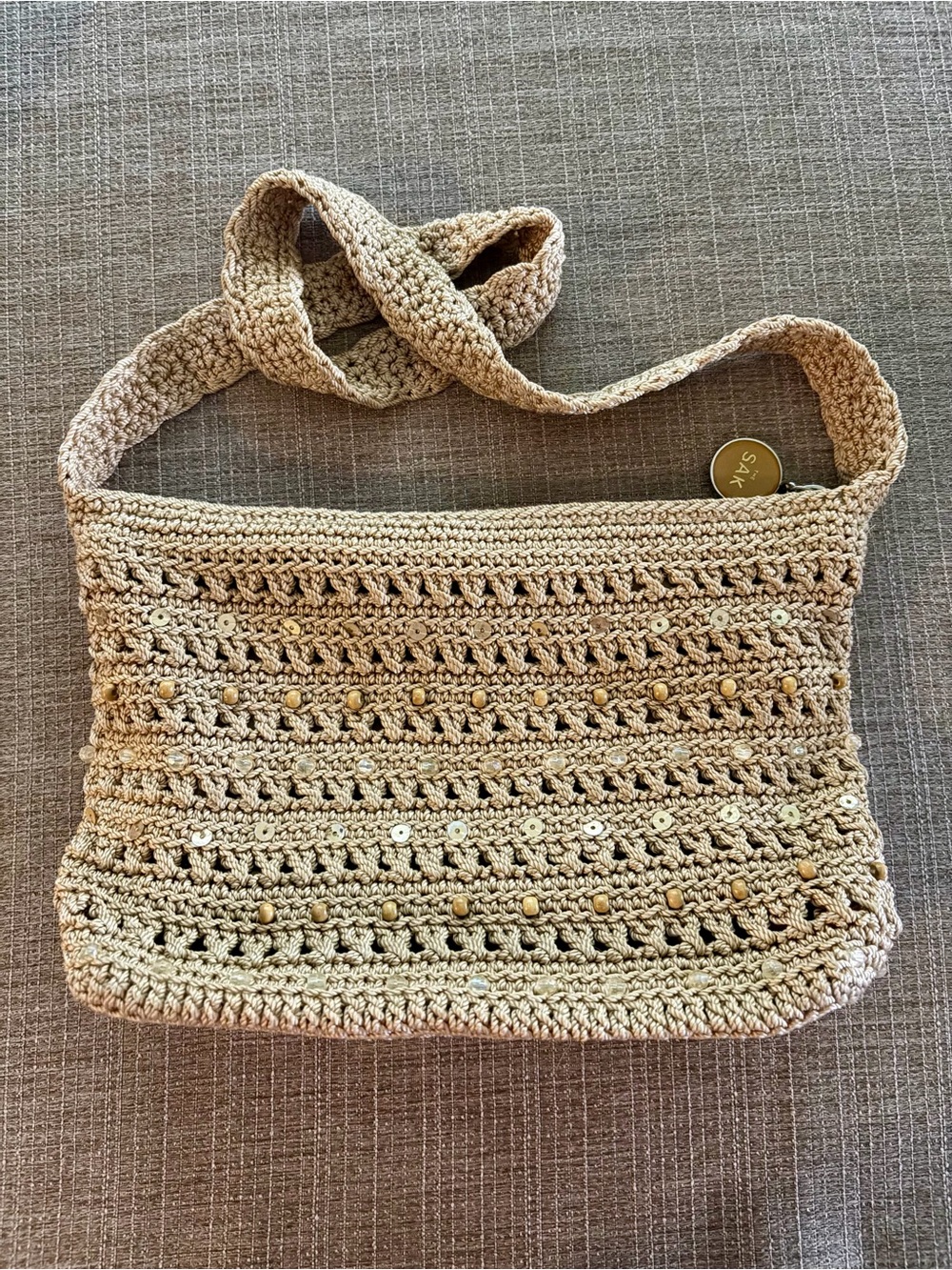 The SAK Beige Crochet Shoulder Bag with Bead Accents